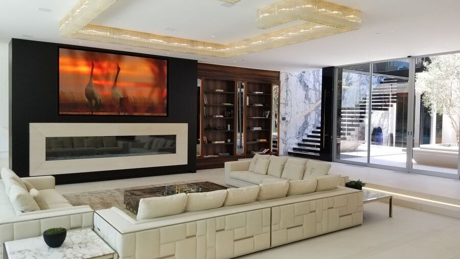 A luxurious living room with hidden AV solutions.