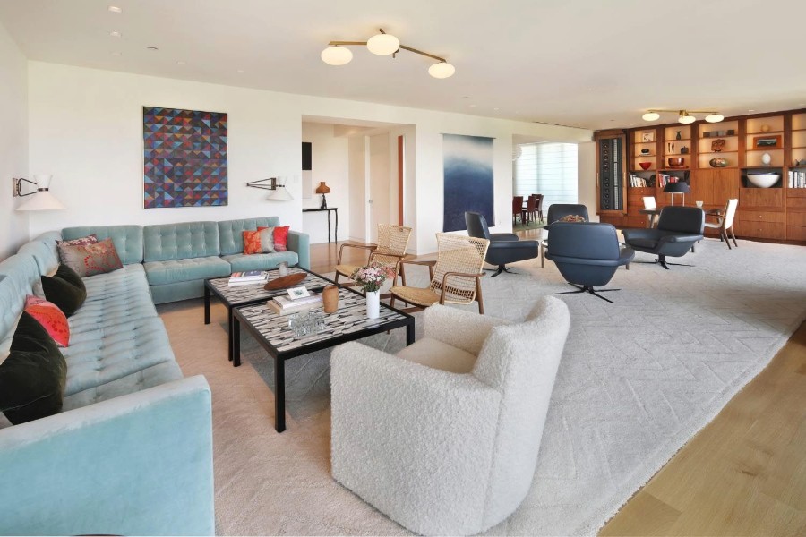 Stylish living room showcasing light blue couches and a modern coffee table.